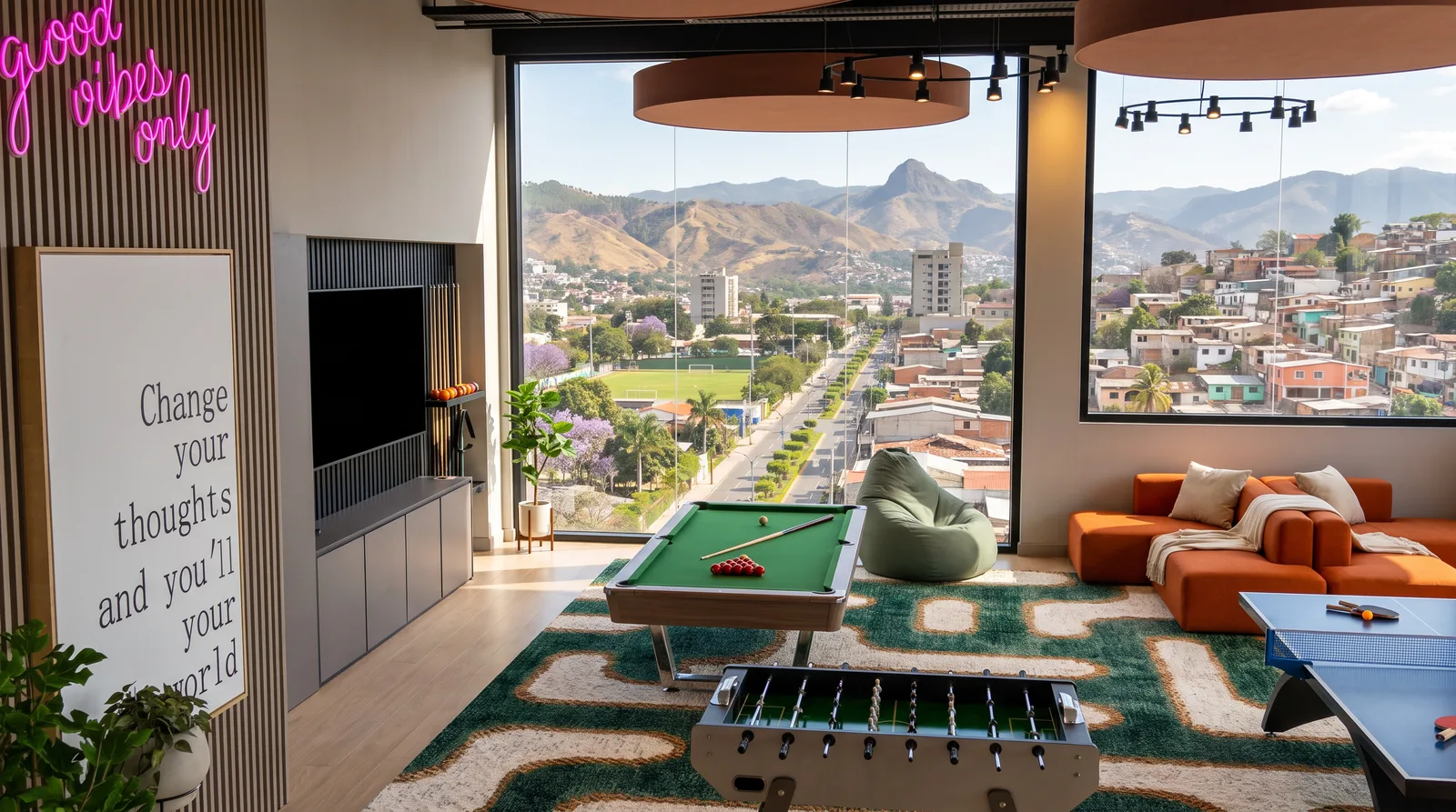 Sala de juegos con billar, futbolín y ping pong frente al ventanal