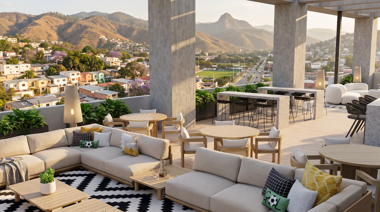 Rooftop con sofás, mesas y barra, con vista a las montañas de Tegucigalpa